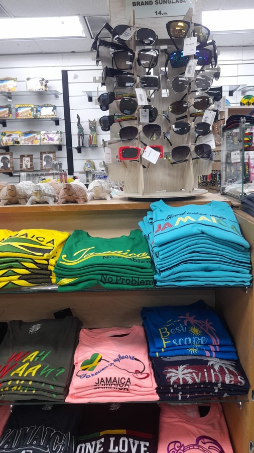 Rotating sunglasses display over folded t-shirts